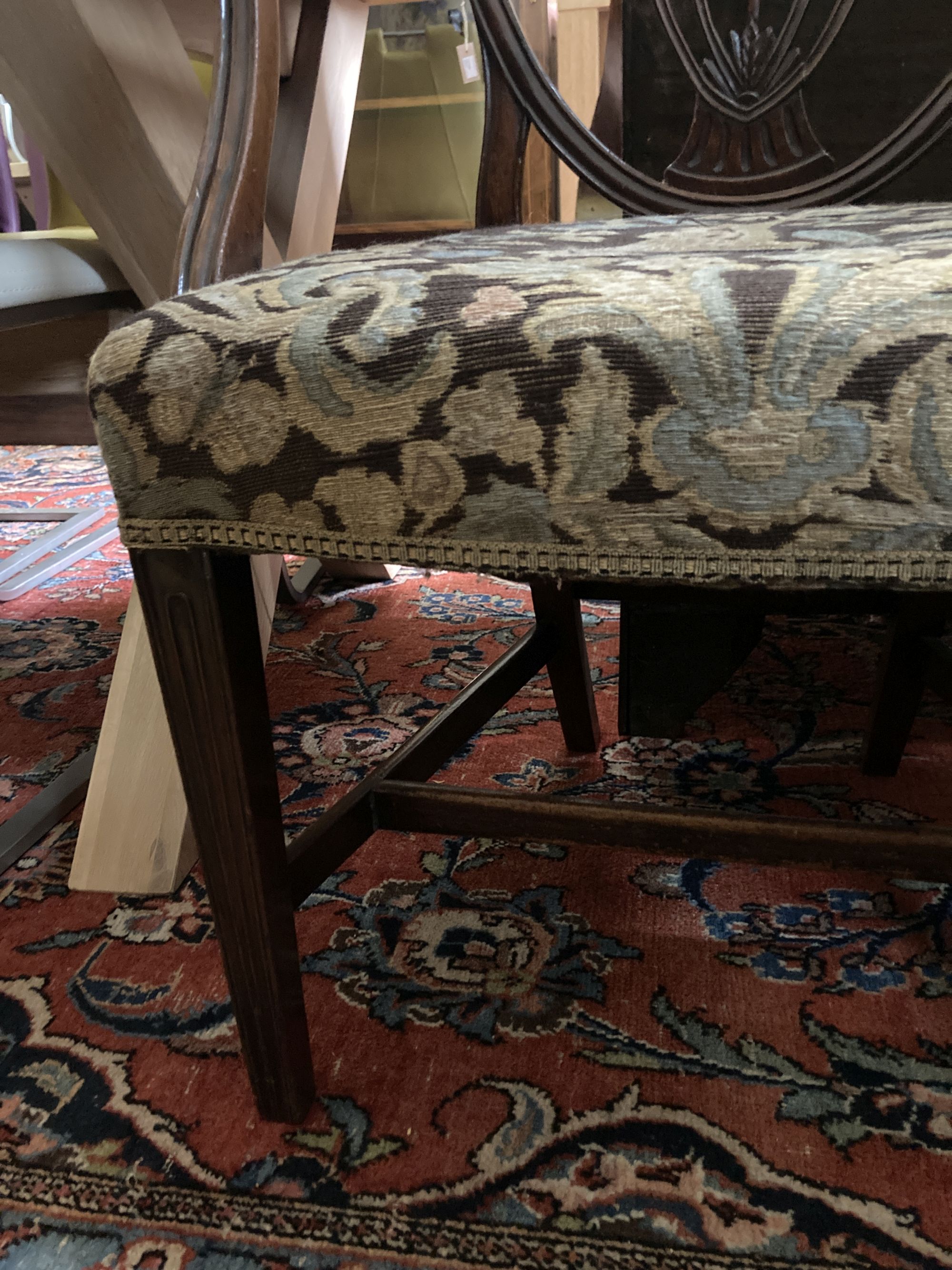 A Hepplewhite style mahogany armchair and a Louis XV walnut fauteuil covered in tapestry